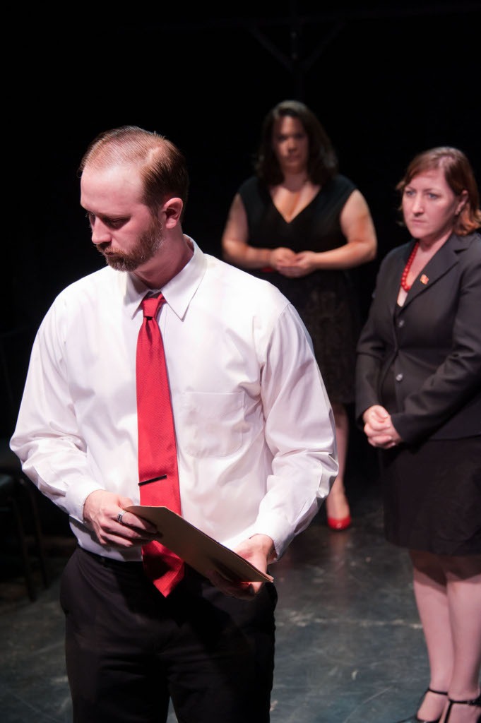 Claudius (John Stange) and Gertrude (Sara Bickler) get news from Voltimand (Pamela H. Leahigh)