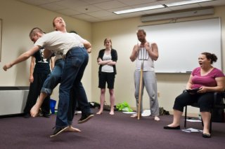 Matthew Ward, Christopher Niebling, Shaina Higgins, John Stange, and Sara Bickler practice violence in the rehearsal room.